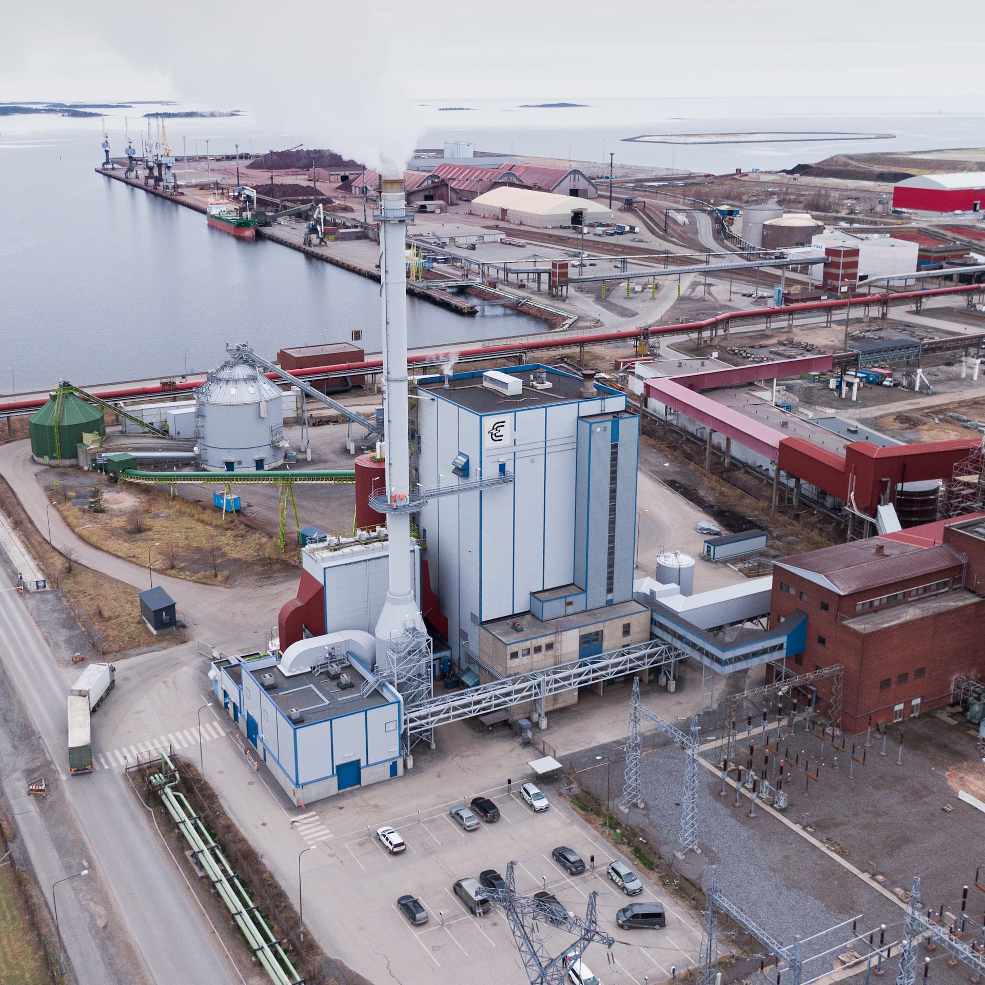 Aerial view of the Kokkolan Energia power plant located at a coastal port facility. Aerial view of the Kokkolan Energia power plant located at a coastal port facility.